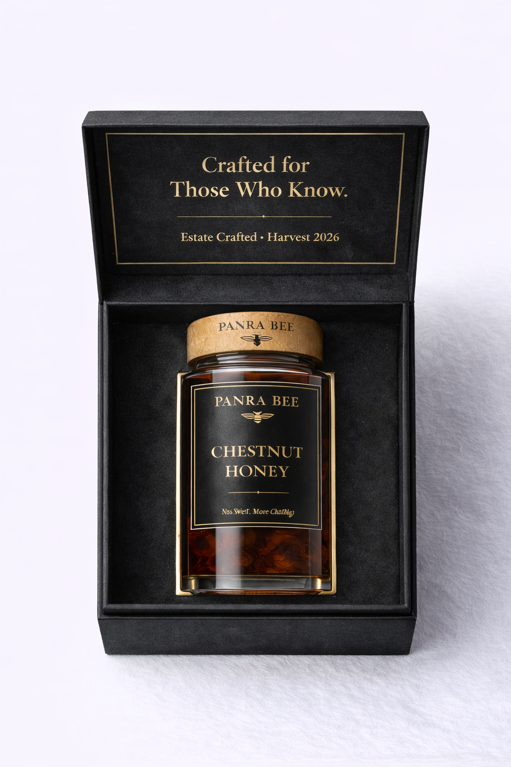 Panra Bee chestnut honey jar presented in a black gift box with gold inscription — Crafted for Those Who Know